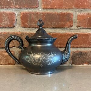 Vintage Silver Teapot with Ornate Design